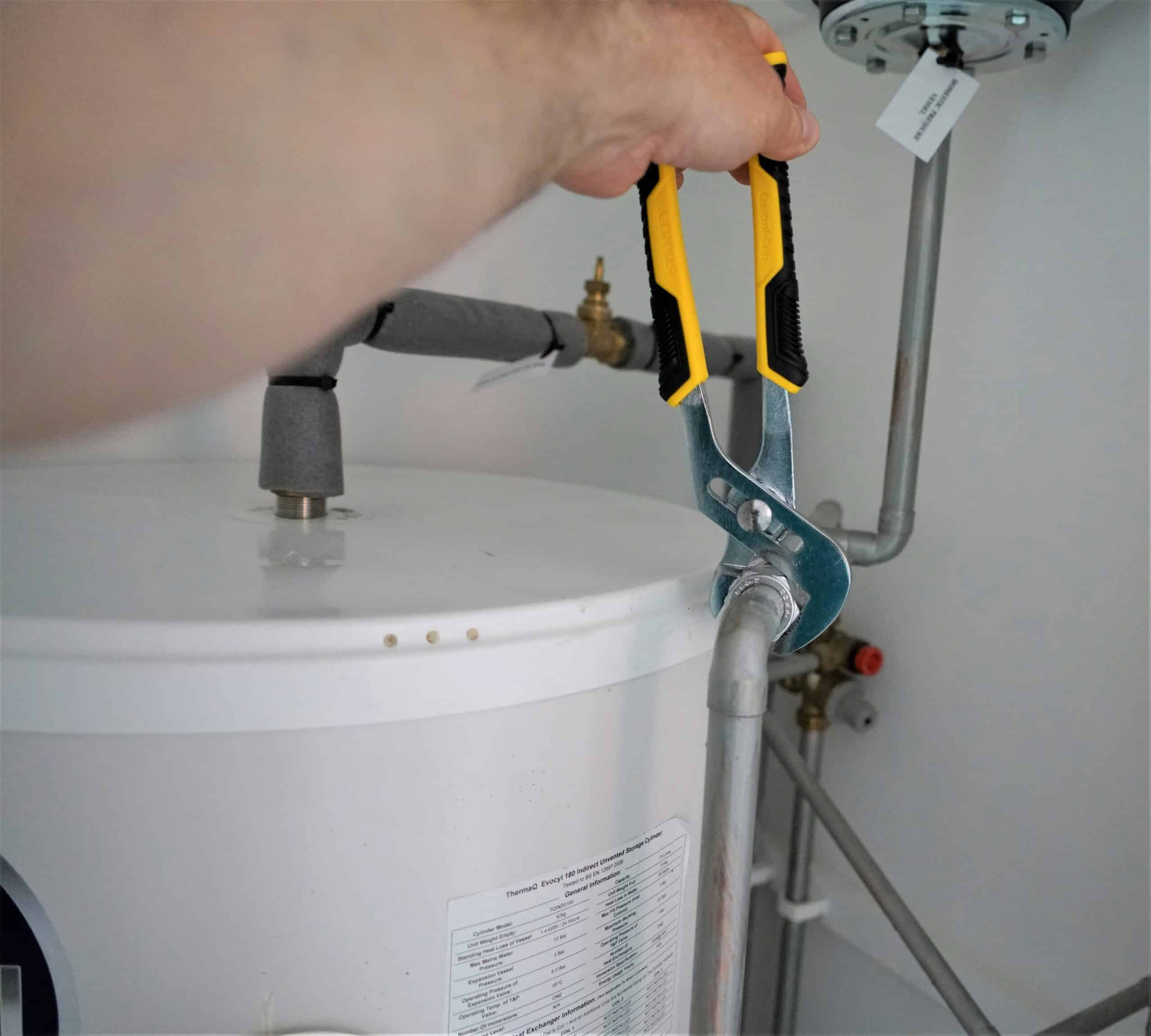 Tax deductible tankless water heater upgrade in progress by Arizona's Dukes of Air